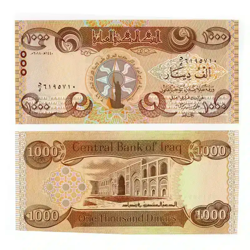 Front of Iraq 1000 dinar unc banknote with sun and boat design and Back with Reverse of 1000 dinar note showing al-Mustansiriya School in Baghdad, ,Iraq 1000 dinar unc banknote held for size and clarity.